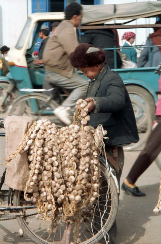 15 Kashgar Old City Street Scene 1993 Boy Carrying Garlic